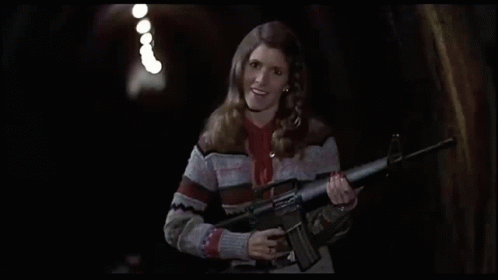 Carrie Fisher Blues Brothers GIF - Carrie Fisher Blues Brothers Submachine Gun GIFs