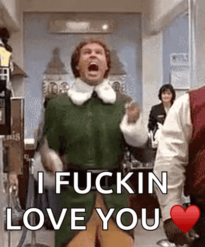 a man in a green elf costume says i fuckin love you with a red heart