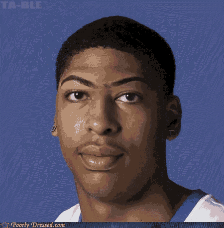 a close up of a man 's face with the website poorly dressed.com visible in the corner