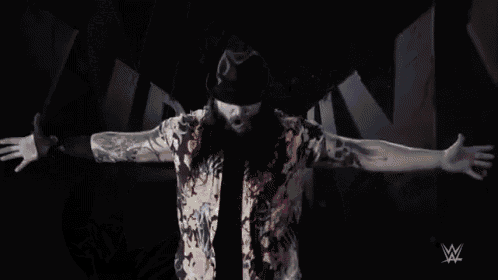 a black and white photo of a wrestler with the name seth rollins written on the bottom .