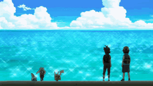 a group of kids are standing on a dock looking out over the ocean