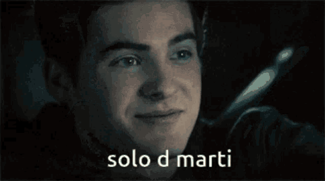 a close up of a man 's face with the words solo d marti written below him