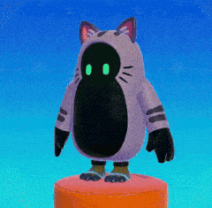 a purple cat with green eyes is standing on an orange block