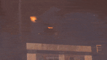 a large explosion with the letter f visible in the sky