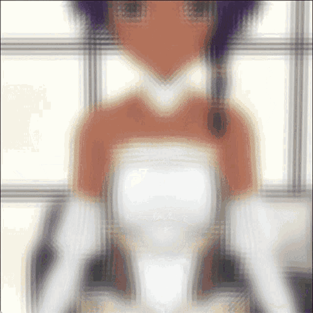 a blurred image of a woman in a white dress