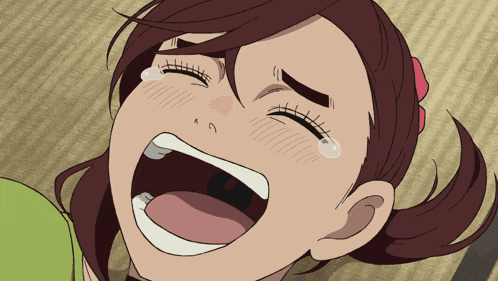 a close up of a girl 's face with her mouth open and tears coming out of her eyes