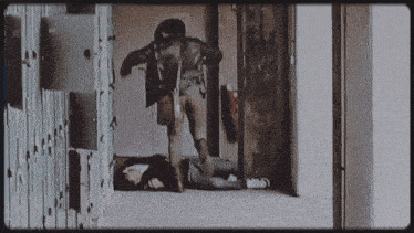 a black and white photo of a person laying on the ground