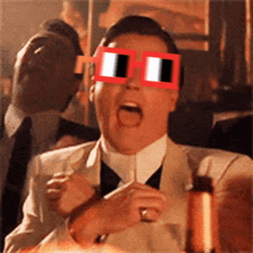 a man in a suit and tie is wearing a pair of red and white glasses