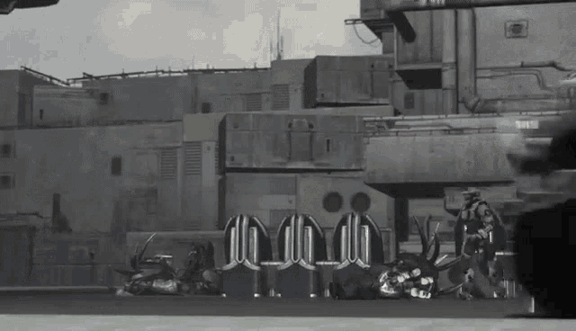 a black and white photo of a military base with a clock that says 10:08