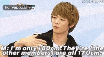 a young man is talking to another young man and says `` m : i 'm only 180 cm .