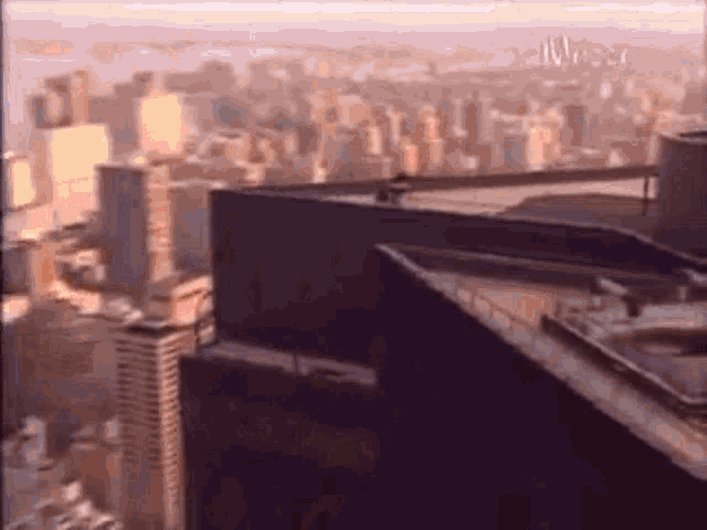 an aerial view of a city from the top of a tall building