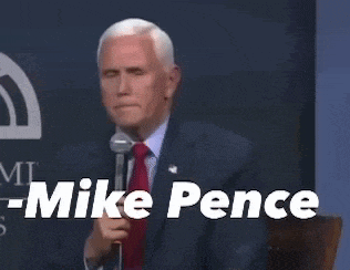 a man in a suit and tie stands in front of a microphone and says that 's not my concern