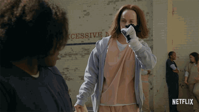 a netflix ad shows a woman wearing a pink shirt