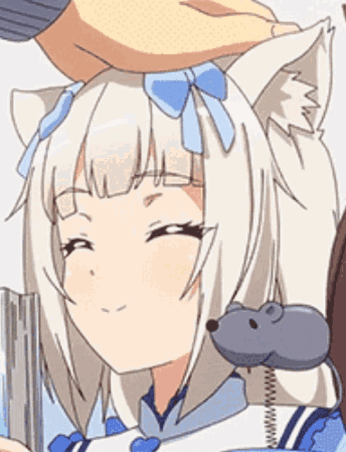 a person is petting a white anime girl 's head with a mouse on her ear .