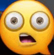a close up of a yellow smiley face with a speech bubble .