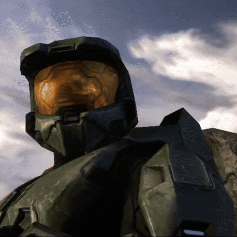 a man in a halo helmet stands in front of clouds