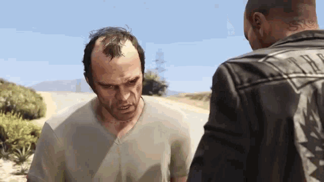two men are standing next to each other on the side of the road .
