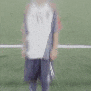 a young boy wearing a jersey with the number 37 on it stands on a soccer field