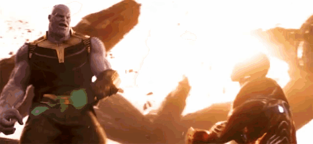 thanos and iron man are fighting each other in a scene from a movie