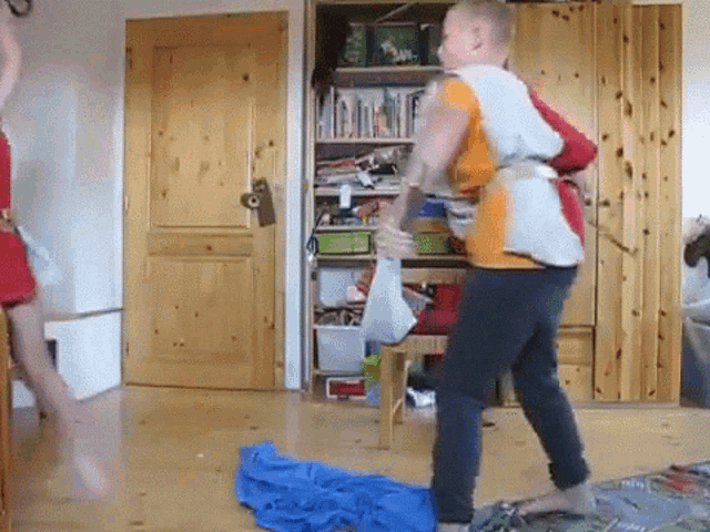 a man and woman are dancing in a room
