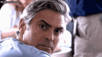 a man with gray hair is looking over his shoulder at the camera with hilariousgifs.com written below him
