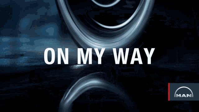 an advertisement for man shows a car wheel and the words on my way