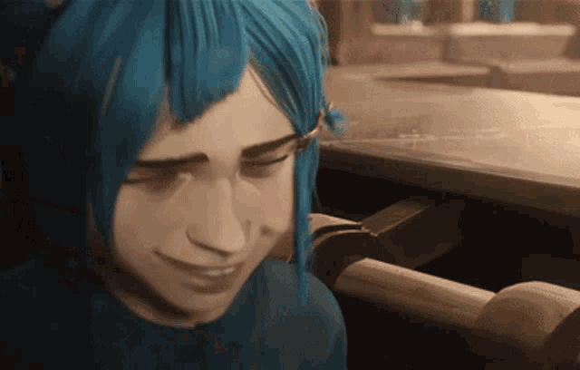 a woman with blue hair is smiling and looking down