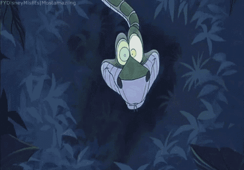 kaa from the jungle book is a cartoon snake with glowing eyes and a long tail .