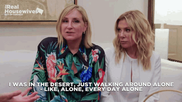 two women are sitting on a couch and one of them says " i was in the desert "