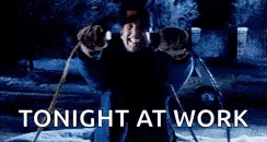 a person is standing in front of a fire with the words `` tonight at work '' written on it .