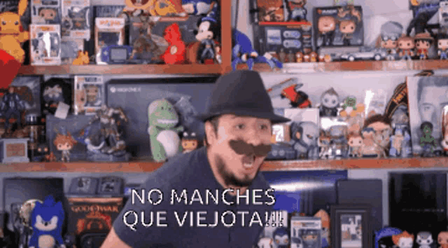 a man with a fake mustache says no manches que viejota
