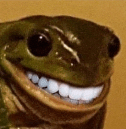 a frog with big white teeth is smiling for the camera .
