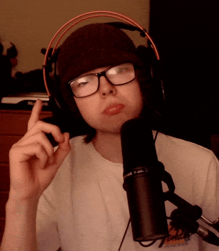 a person wearing headphones and a shirt that says fender