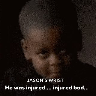 a young boy with a wrist injury is making a funny face .