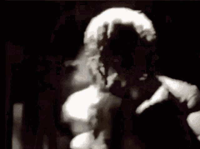 a close up of a person 's face with a wig on .