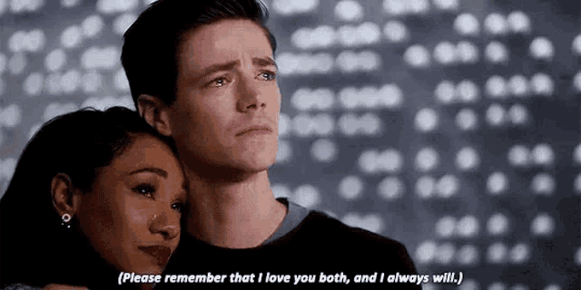 a man and a woman are standing next to each other and hugging .