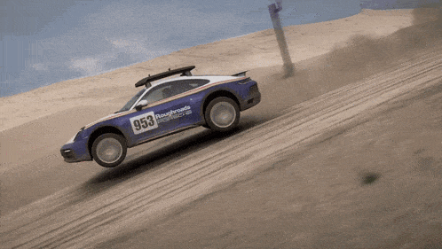a blue and white race car with the number 953 on the side