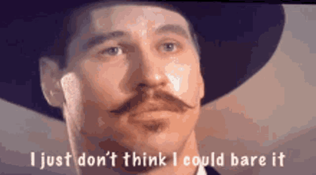 a man with a hat and mustache is saying i just don 't think i could bare it