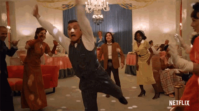 a group of people are dancing in a room with netflix written on the bottom
