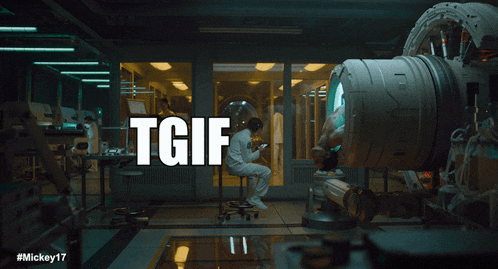 a man in a space suit sits in a room with a tgif sign above him