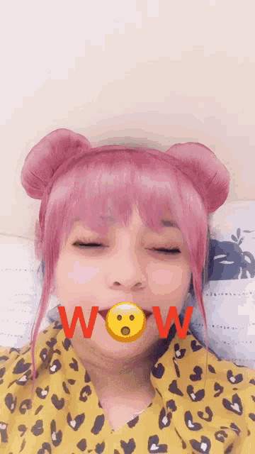 a woman with pink hair and a leopard print shirt has wow written on her face