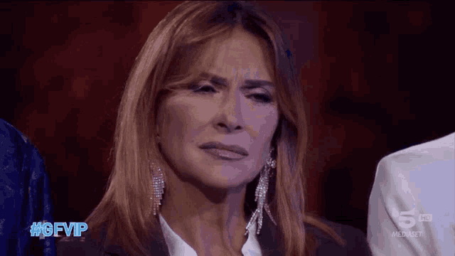 a woman crying on a tv show with the hashtag #gfvip on the bottom