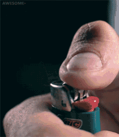 a person is holding a green bic lighter