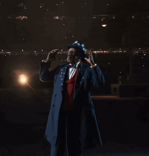a man dressed as uncle sam says ghetto in a dark room