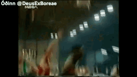 a blurry picture of a group of people dancing in a dark room