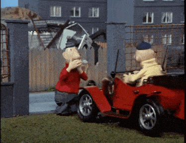 two cartoon characters are playing with a toy car