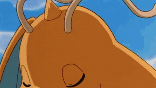 a close up of a dragon with its eyes closed .