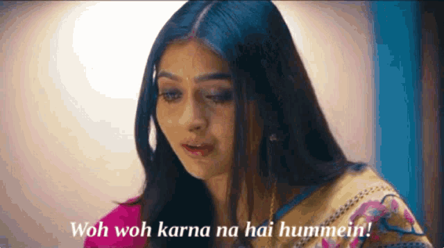 a close up of a woman 's face with the words wah wah karna na hai hummein