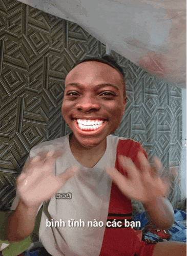 a man with braces on his teeth is wearing a shirt that says a ciga