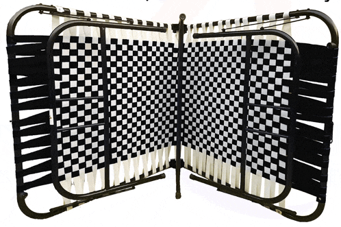 a black and white checkered folding bed